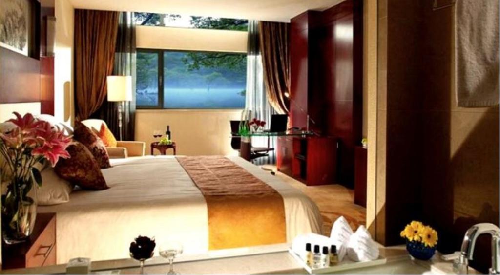 New Century Fengming Resort Zaozhuang Room photo